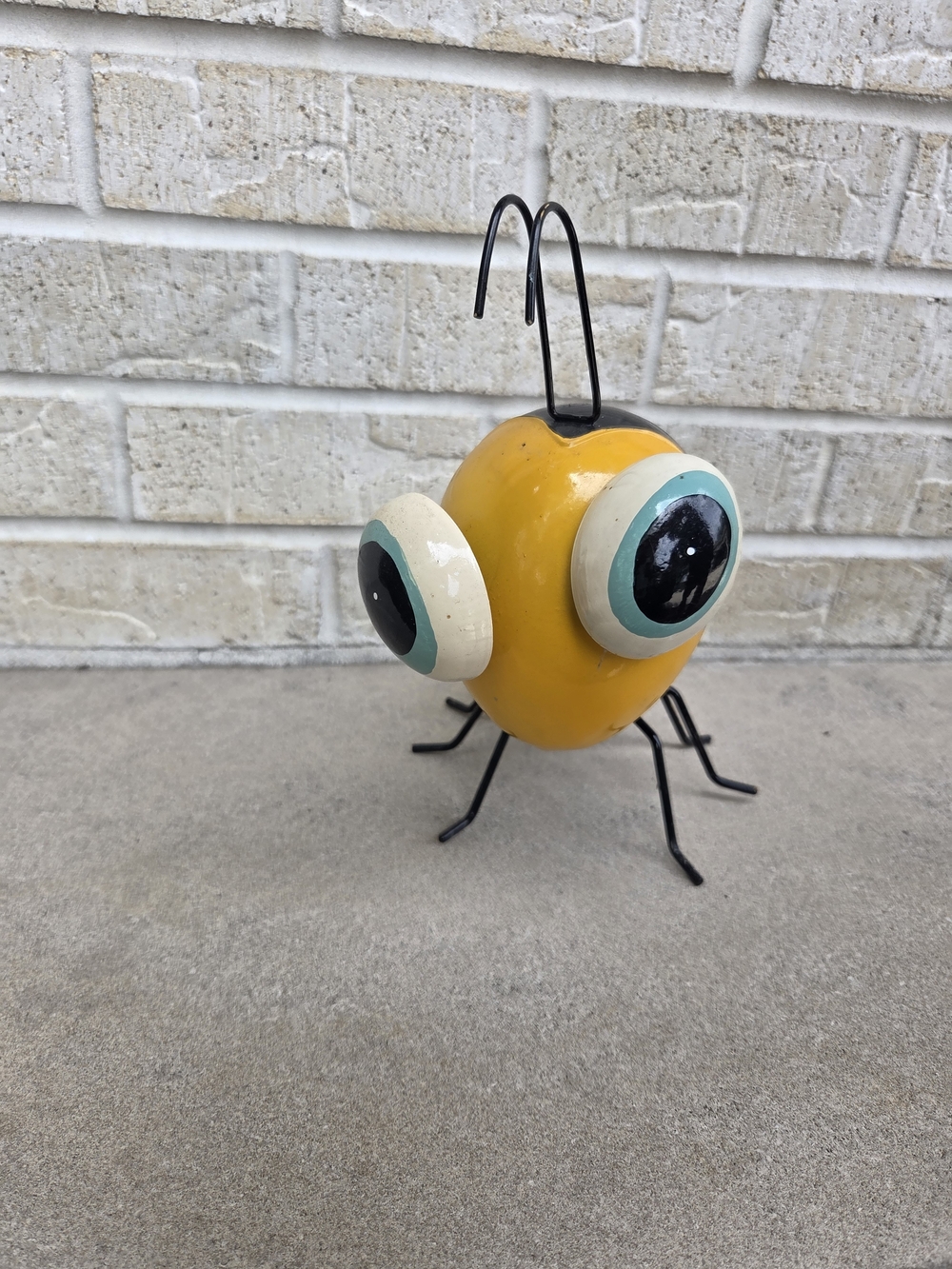 Whimsical Yellow Metal Bug Figurine with Big Eyes